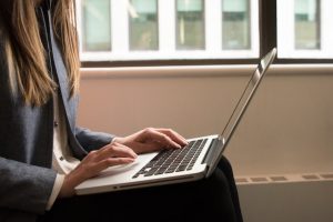 Image of woman using laptop in Alderley.